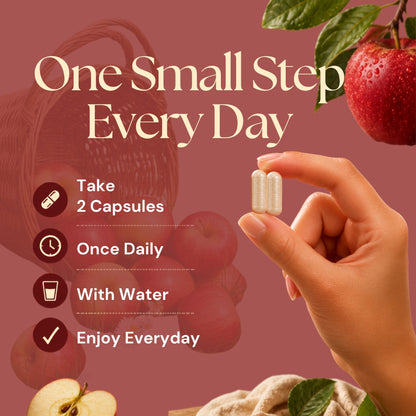 Hand holding two Apple Pectin capsules with daily use instructions: take 2 capsules once daily with water.